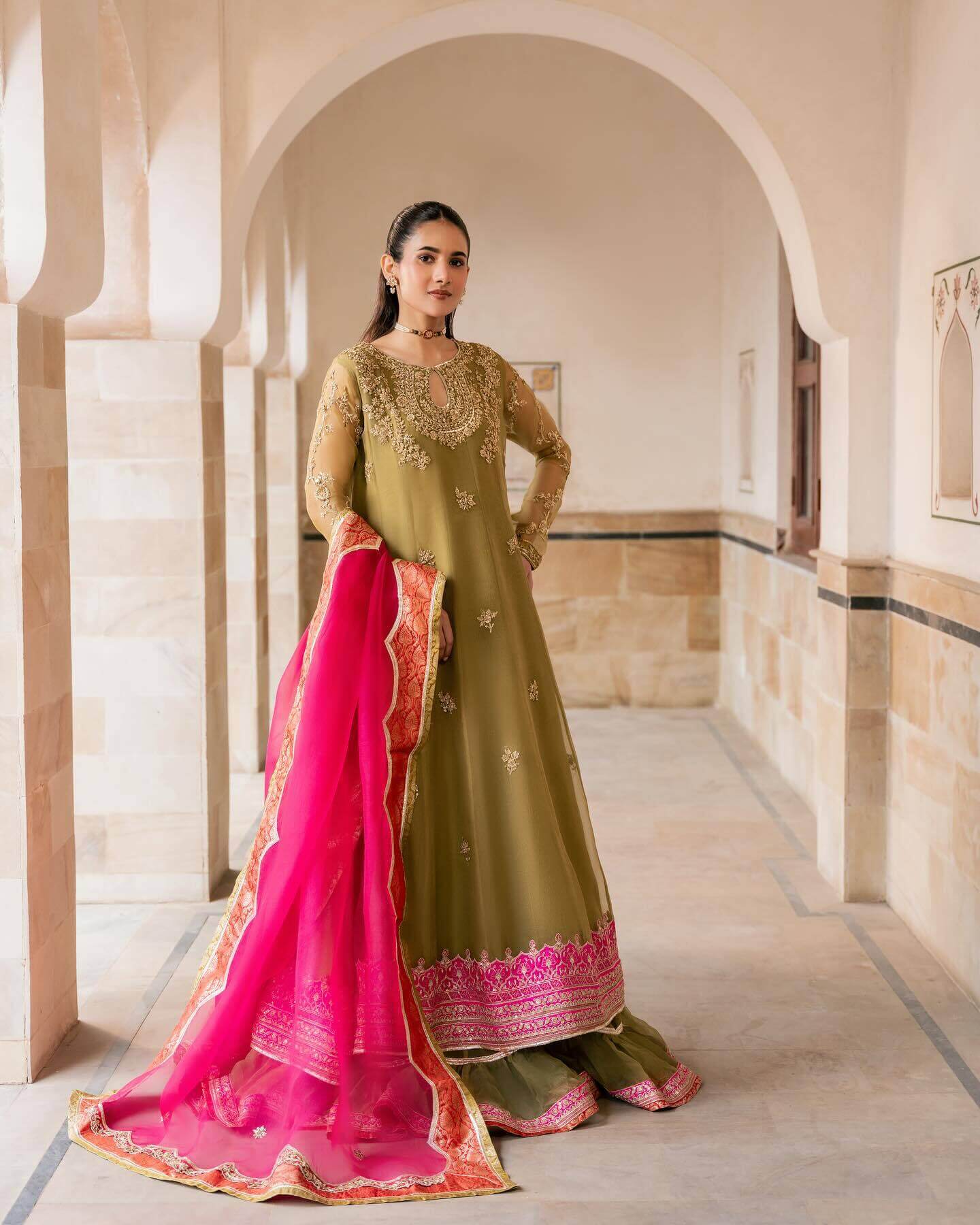 Model in a green traditional dress