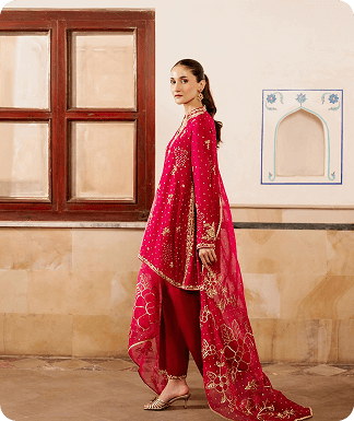 Back view of a model in a green traditional dress